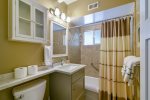 The hall bath has recently been remodeled and has a shower/tub combo.